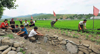 N. Korean media urges simultaneous action against flooding, drought