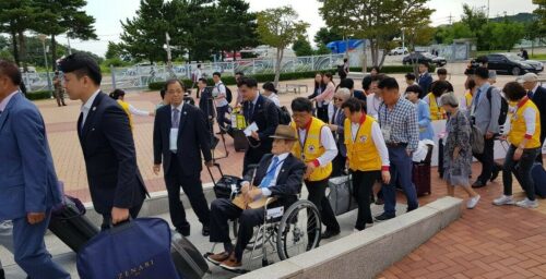 Two Koreas begin first family reunions in almost three years