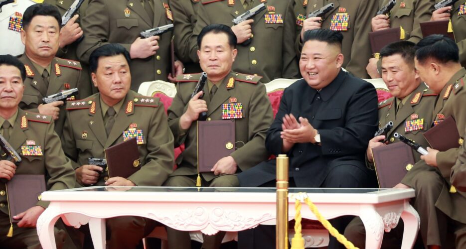 Kim Jong Un gifts guns to army officers as North Korea marks war anniversary