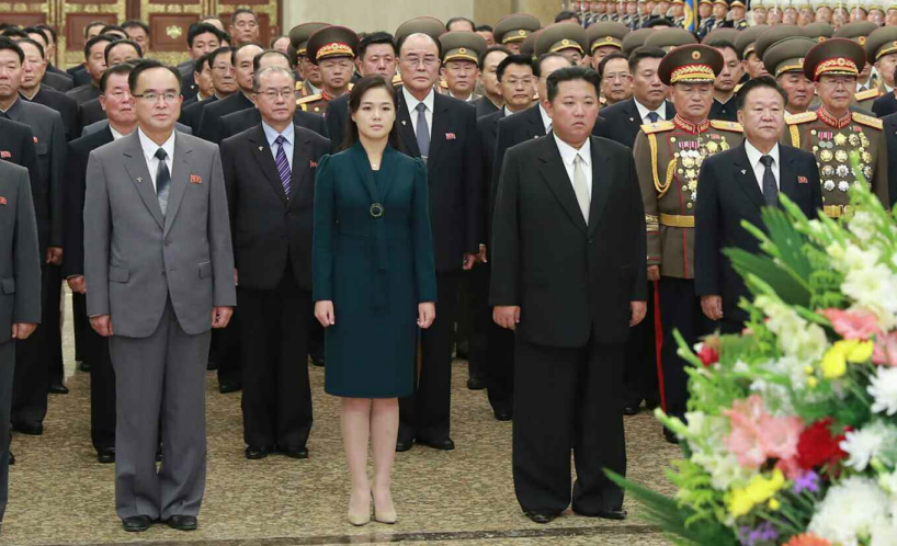 Kim Jong Un visits shrine with wife, meets military parade paratroopers