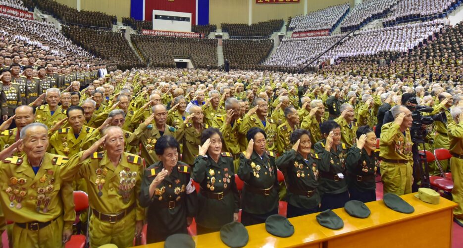 Elderly North Korean veterans pack stadium for conference despite COVID spread