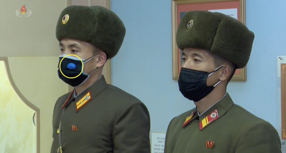 More North Koreans sticking mysterious objects on face masks, state media shows