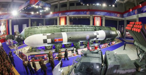 Kim Jong Un shows off new drones and ICBMs at arms expo, rejects talks with US