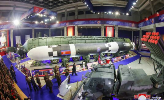 Kim Jong Un shows off new drones and ICBMs at arms expo, rejects talks with US