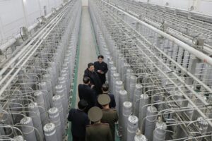 Kim Jong Un visits uranium enrichment site, says clash with enemies 'inevitable'