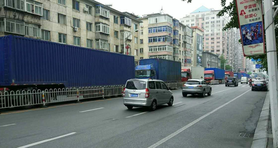 Convoy of trucks seen crossing from China to North Korea under police escort